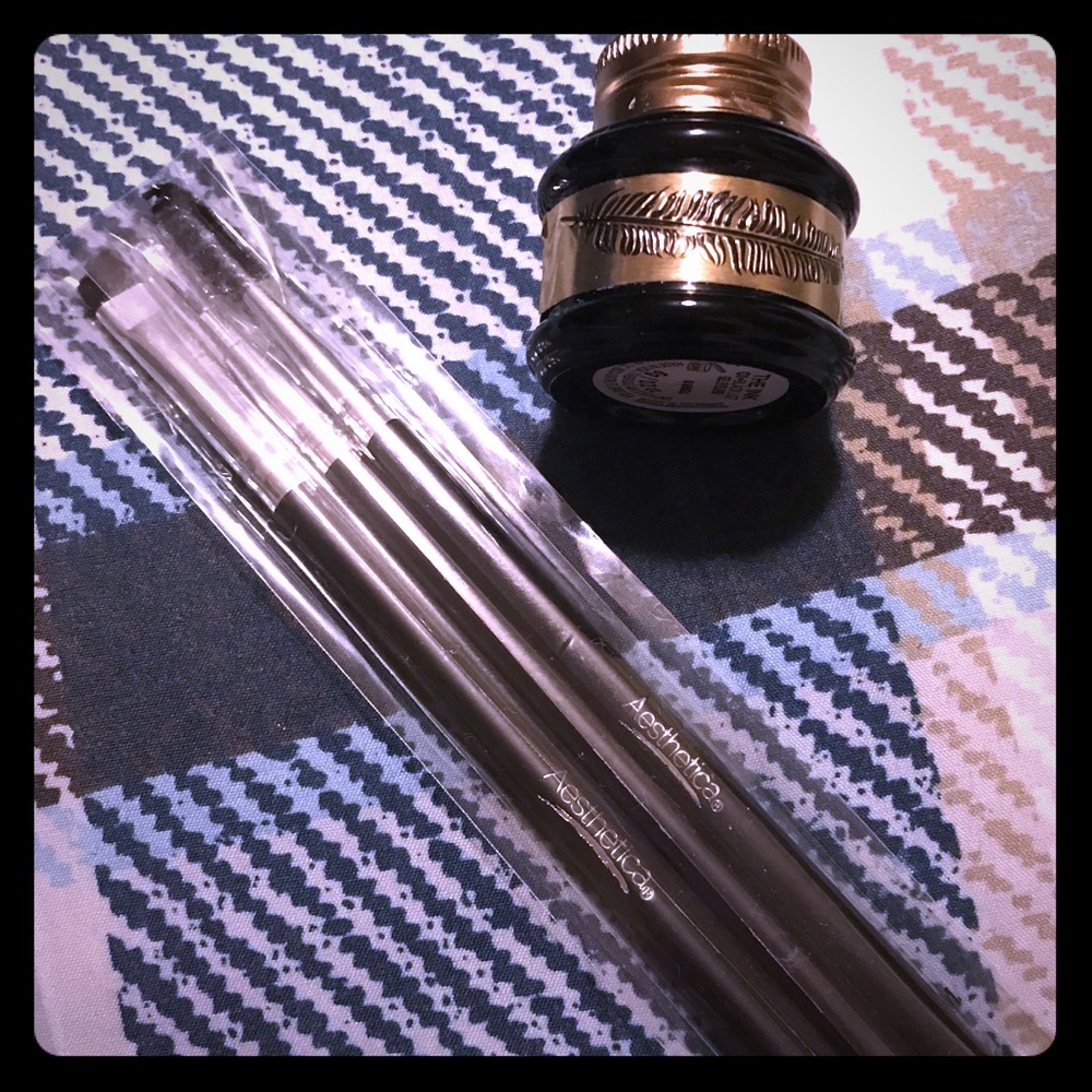 Black liquid eyeliner and brushes